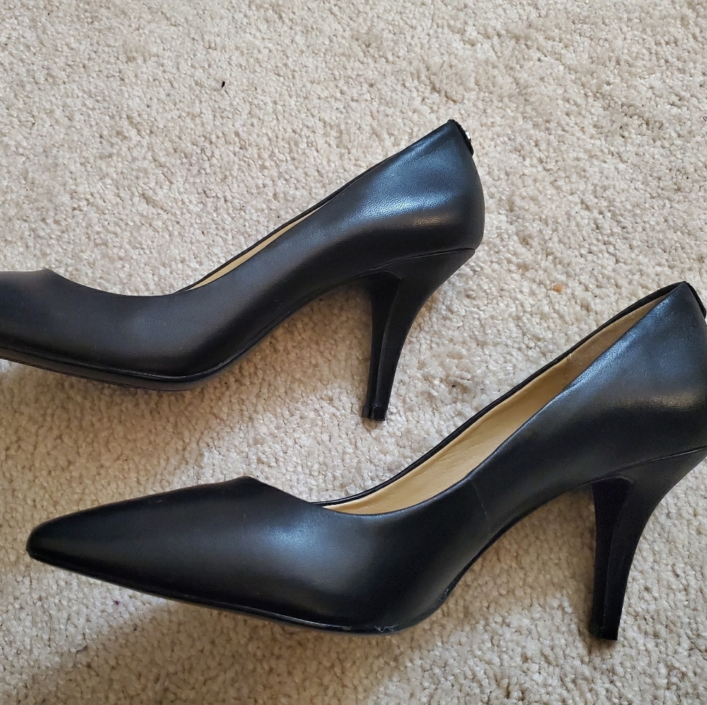 Black leather pumps